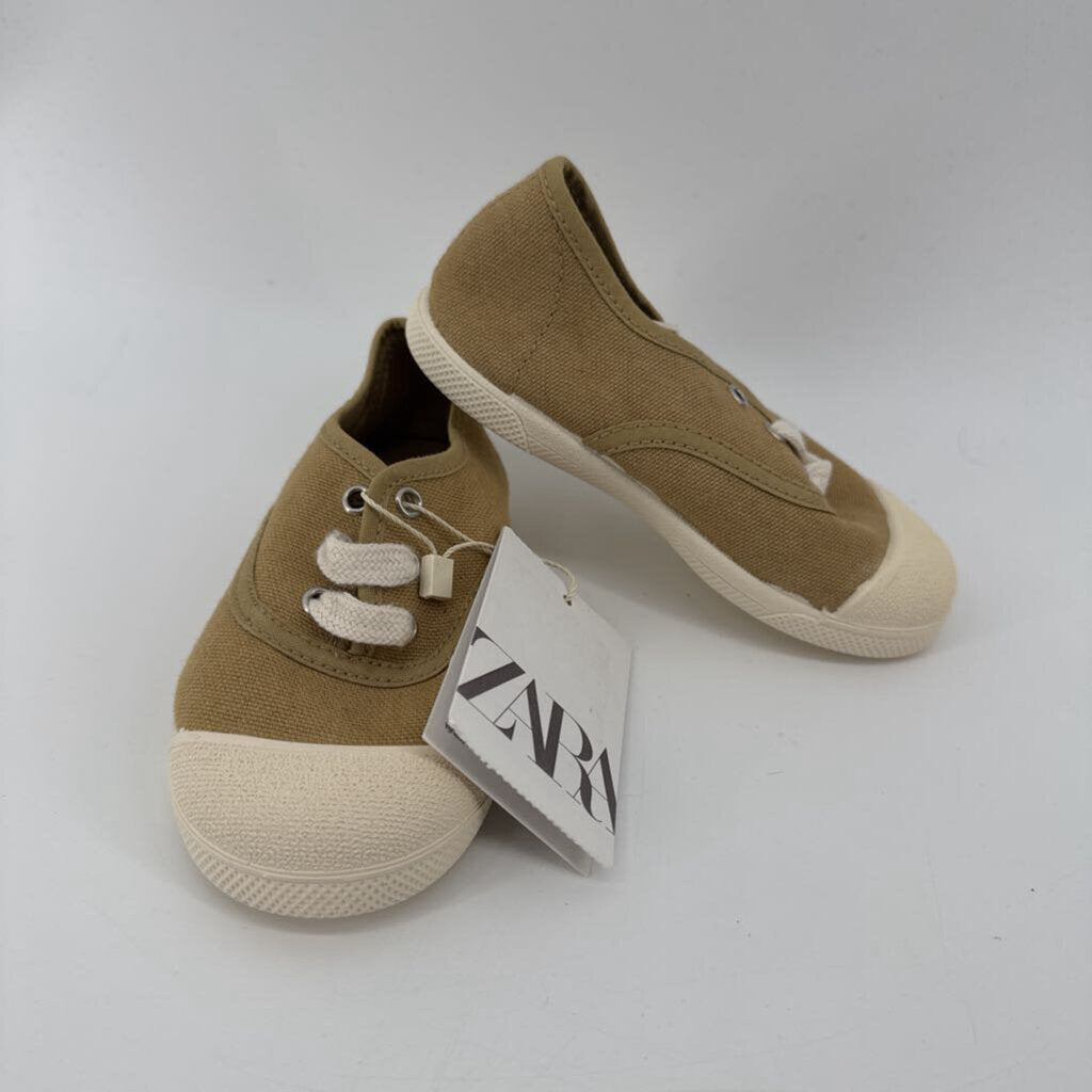Tags on, sneakers