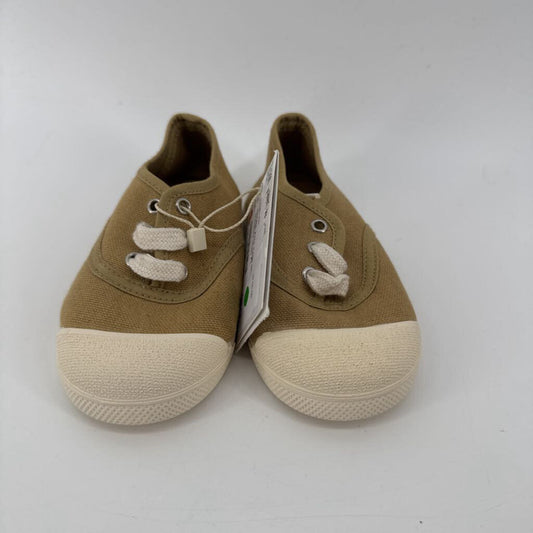 Tags on, sneakers