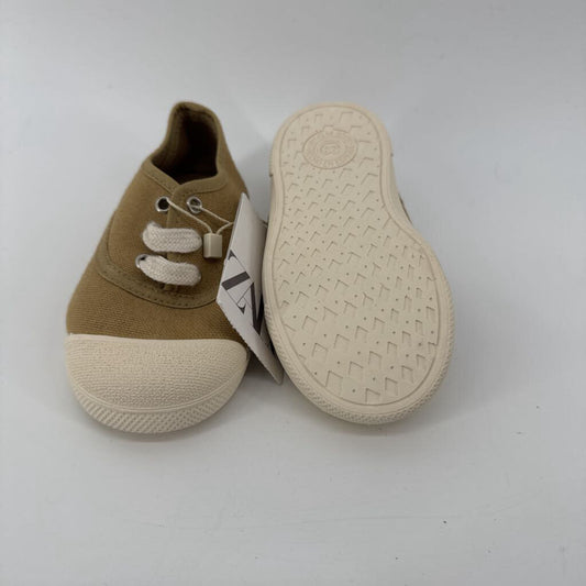 Tags on, sneakers