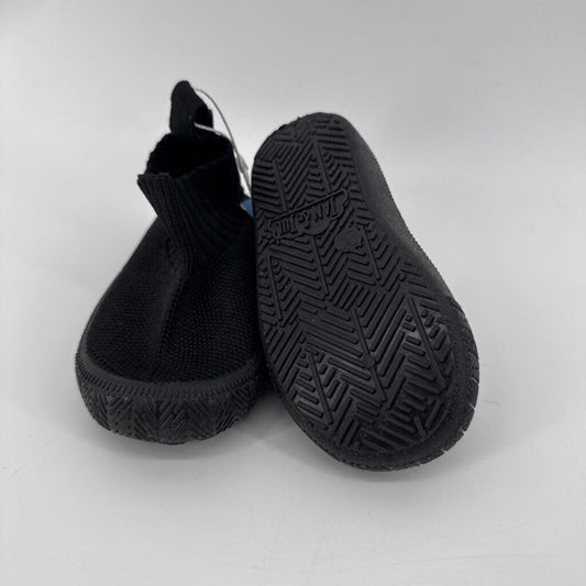 Tags on, knit shoe