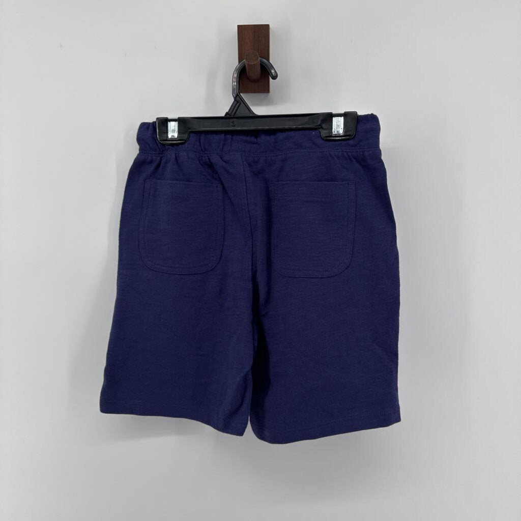Tags on, polo t-shirt and chino pants