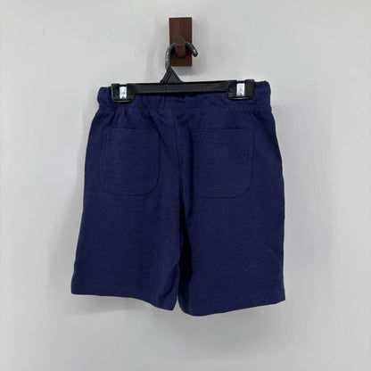 Tags on, polo t-shirt and chino pants