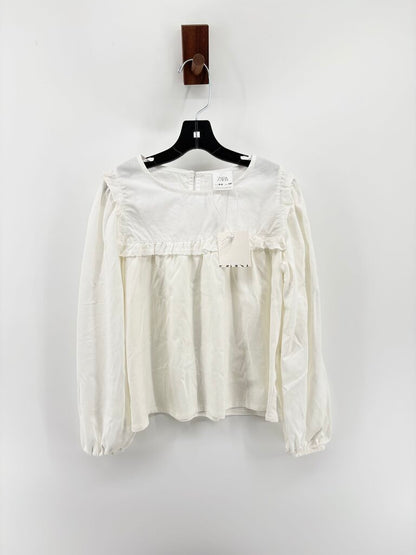 Tags on, long sleeve ruffle details