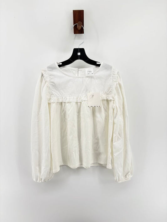 Tags on, long sleeve ruffle details