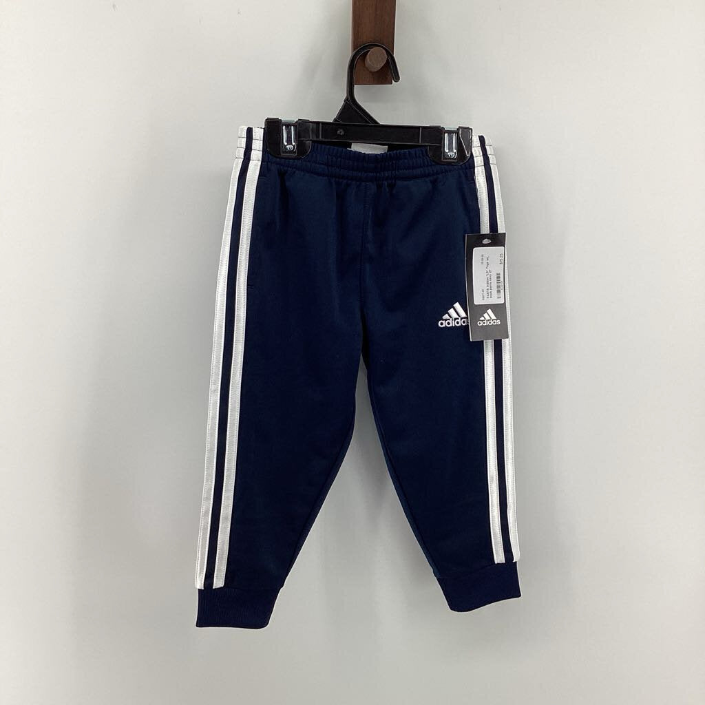 Tags on, track pants